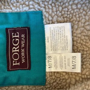 Blue vest, with wool inside.